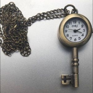 Working clock necklace in the shape of a key